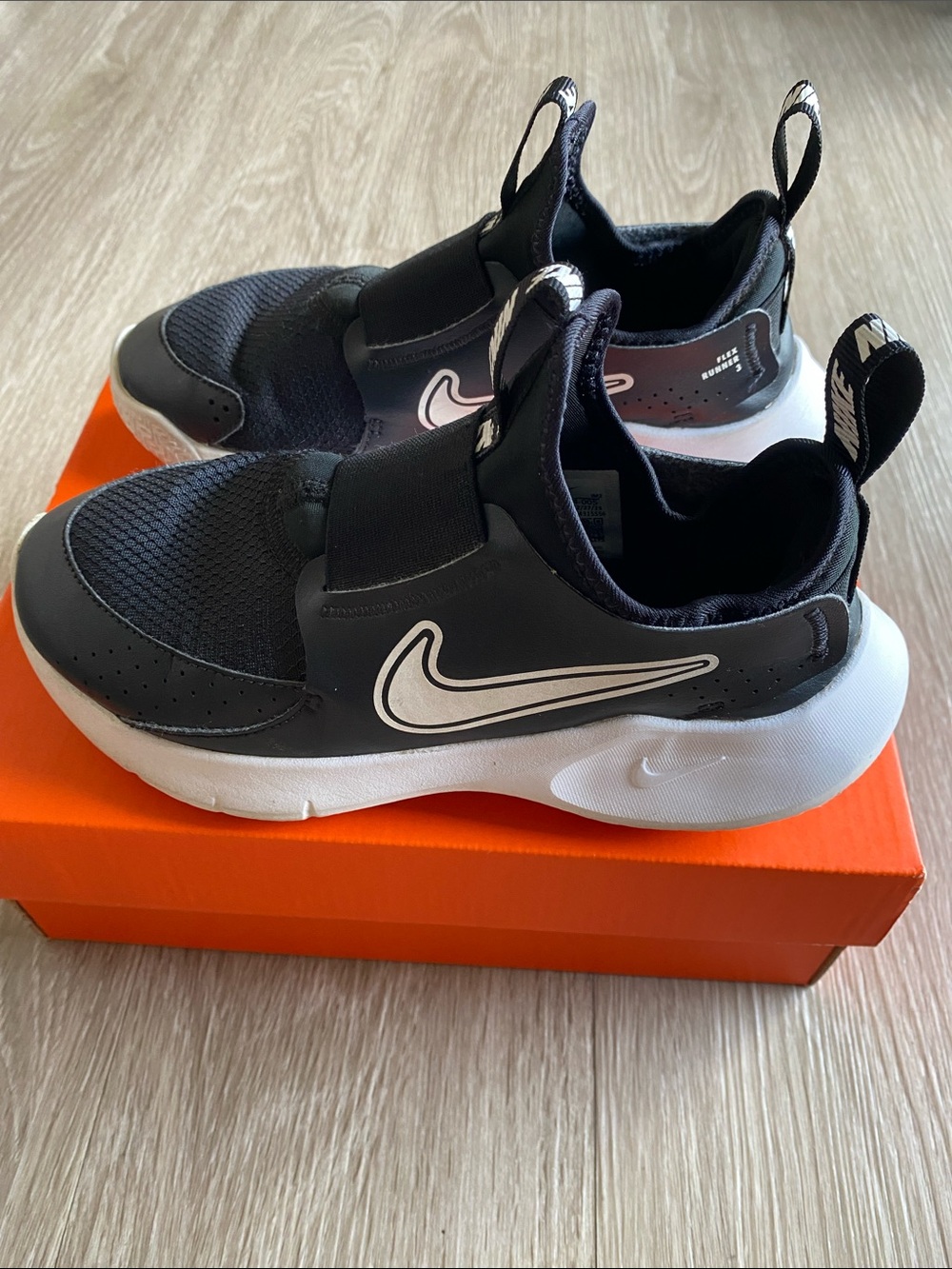 Nike Kids Black and White Slip-On Sneakers with Swoosh